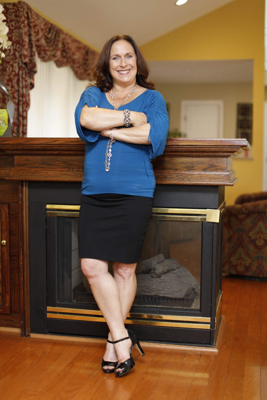 Business coach Nancy Ganzekaufer at home by the fireplace Business coach Nancy Ganzekaufer at home by the fireplace
